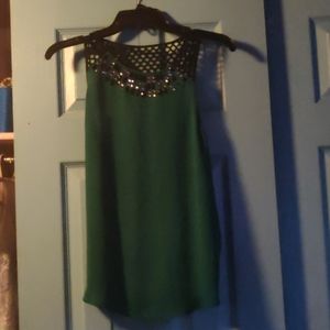 Express top, missing a rhinstone